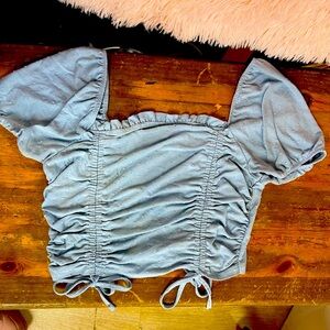A very cute Crop top in like a dusty blue🩵